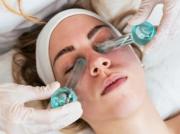 Woman receiving cryotherapy service.